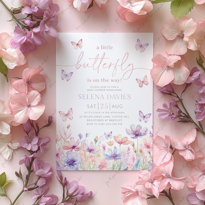 May include: A baby shower invitation with a watercolor illustration of butterflies and flowers. The invitation is for Selena Davies and is on Saturday, August 25th at 3 o'clock in the afternoon. The address is 22 Wildflower Lane, Castle Hill. RSVP to Ruby at 0412 345 678.
