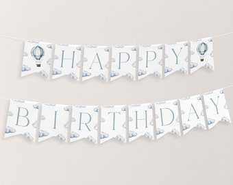 May include: A white banner with blue clouds and hot air balloons that reads "Happy Birthday".