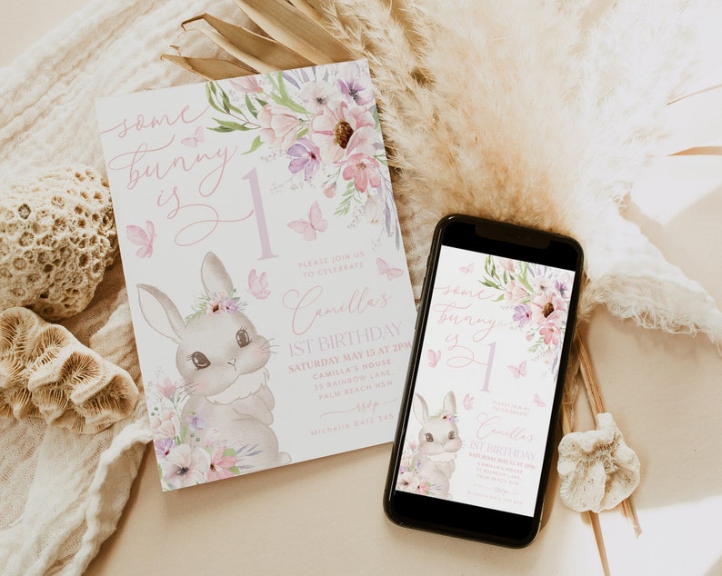 May include: A birthday invitation with a bunny illustration and the text "Some bunny is 1". The invitation features floral and butterfly accents in shades of pink and purple. A smartphone displays the same design.