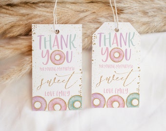 May include: Two white thank you tags with pink and blue donuts and gold glitter. The text on the tags reads "Thank You for making my party so sweet Love Emily".