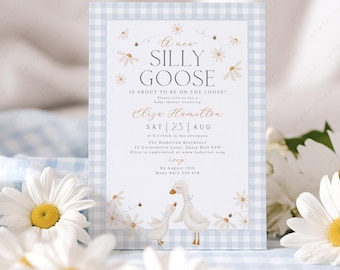 May include: A blue and white gingham baby shower invitation with a watercolor illustration of two geese and daisies. The text reads "A new Silly Goose is about to be on the loose!"  Please join us for a baby shower honoring Eliza Hamilton, Sat 23 Aug at 2 o'clock in the afternoon. The Hamilton Residence, 22 Gooseberry Lane, Daisy Hill NSW. Eliza is registered at www.babylist.com. RSVP by August 15th, Ruby 0412 345 678.