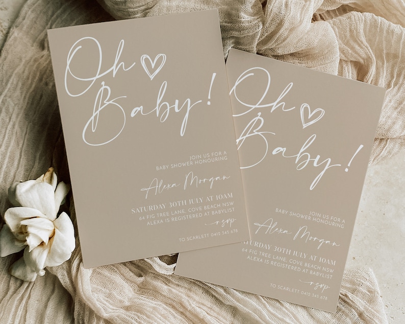 May include: Two beige baby shower invitations with white calligraphy that reads "Oh Baby!" and includes details for the event, including the date, time, location, and contact information.