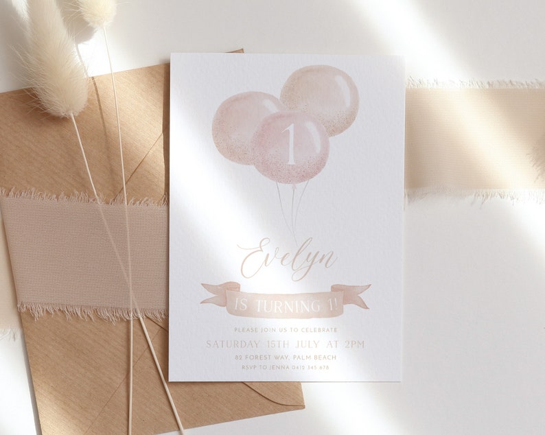 May include: A birthday invitation featuring three pink balloons with the number 1. The invitation includes the name "Evelyn" in elegant script, along with event details: "IS TURNING 1", date, time, and location. The invitation is on a white background.