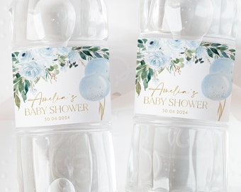 May include: Two clear water bottles with blue and white floral labels. The labels have gold text that reads "Amelia's Baby Shower" and "30.06.2024".