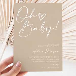 May include: A beige baby shower invitation with white script that reads "Oh Baby!" with a heart. The invitation includes the details of the event, including the date, time, location, and RSVP information.