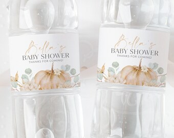 May include: Two clear plastic water bottles with labels that say "Bella's Baby Shower Thanks for coming!" The labels feature a watercolor illustration of a pumpkin, leaves, and flowers.