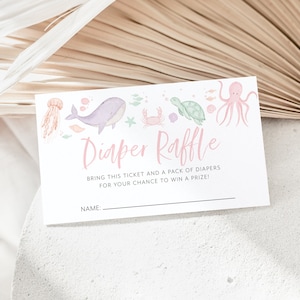 Może przedstawiać: Różowo-niebieski bilet do loterii z pieluchami z ilustracją wieloryba, żółwia, kraba i ośmiornicy. Tekst brzmi "Diaper Raffle" i "Bring this ticket and a pack of diapers for your chance to win a prize!" z pustą linią na imię.