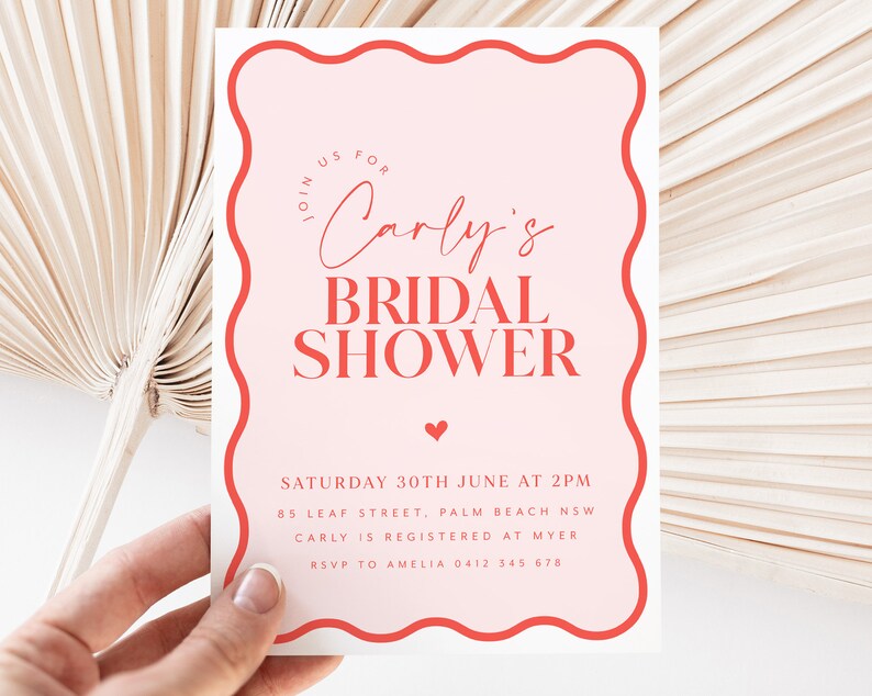 May include: Pink and red bridal shower invitation with a wavy border. The invitation reads "Join us for Carly's Bridal Shower" and includes the date, time, location, and RSVP information.