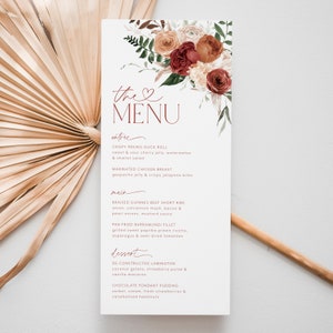May include: A wedding menu with a floral design featuring red, orange, and white flowers. The menu includes entree, main, and dessert options. The text reads "the MENU" with a heart symbol.