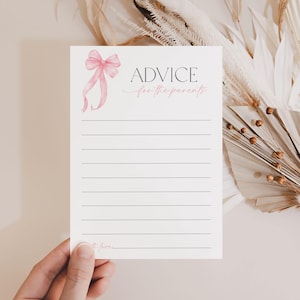 May include: A white card with a pink bow and the text "ADVICE for the parents" printed on it. The card has lined spaces for writing advice.