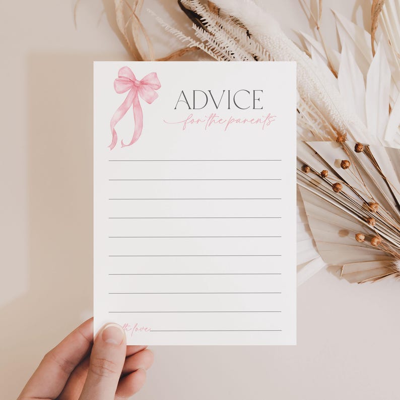 May include: A white card with a pink bow and the text "ADVICE for the parents" printed on it. The card has lined spaces for writing advice.