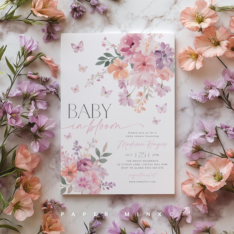 May include: A baby shower invitation featuring a floral design in shades of pink and purple. The text reads "Baby in Bloom" and includes the name "Madison Hayes" and the date "Oct 1 25 1 2PM".