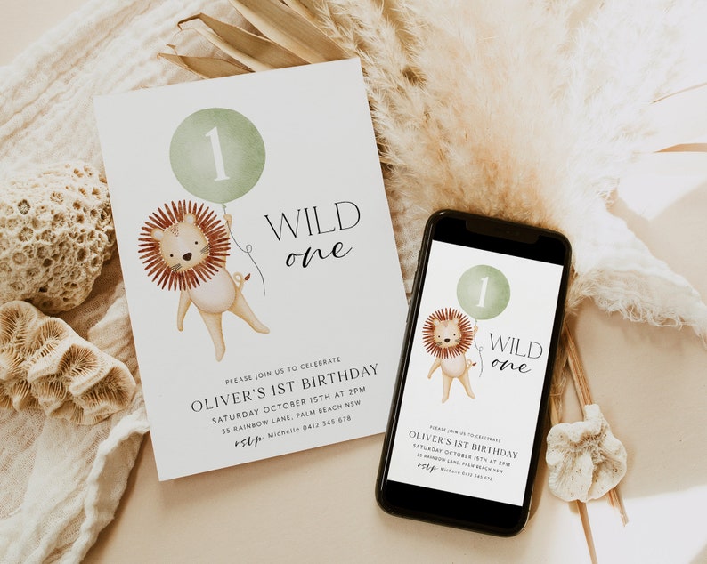 May include: A digital and printed invitation for a first birthday party. The invitation features a cartoon lion holding a green balloon with the number one on it. The text on the invitation reads "Wild One" and includes the party details.
