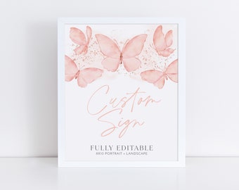 May include: A white frame with a pink and white custom sign with the text "Custom Sign" and "FULLY EDITABLE 8x10 PORTRAIT - LANDSCAPE". The sign features a watercolor design of pink butterflies.
