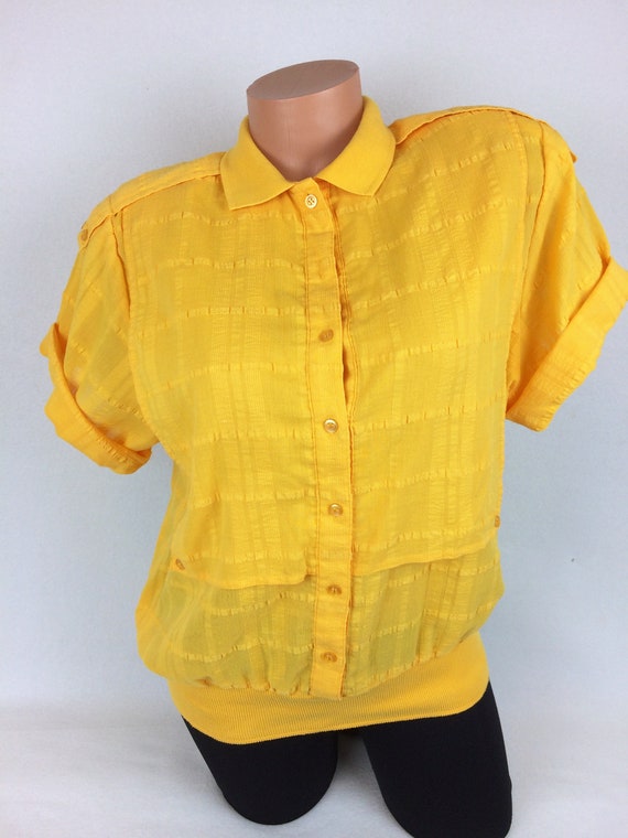 mustard yellow polo shirt