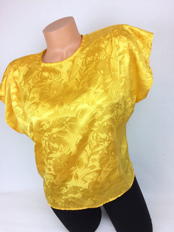 yellow top with flowers
