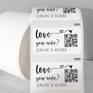 May include: Roll of white sticker labels with black text and a QR code. The text reads "love your order? SCAN ME TO REORDER".