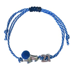 May include: Blue and white striped string bracelet with a silver charm of a shoe and the number 21. The bracelet has a blue pom-pom on the end.