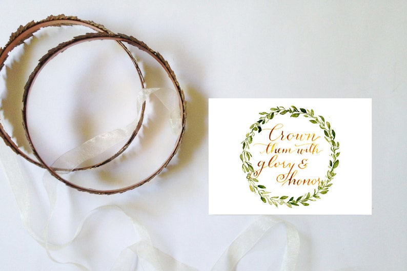 May include: A white card with a gold calligraphy quote "Crown them with glory & honour" surrounded by a green watercolour wreath.