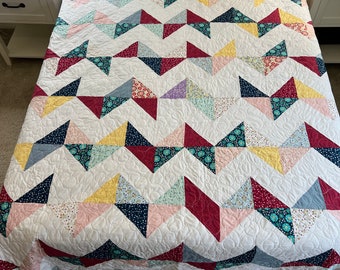 Calming half square triangle quilt in queen size