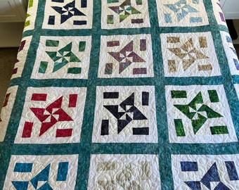 Batik backed pinwheel quilt