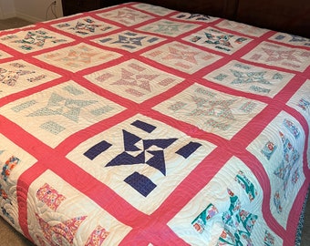 Pinwheel quilt with pink borders