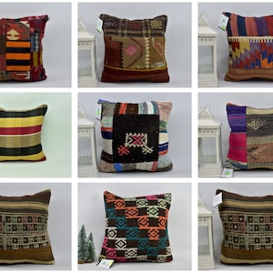 May include: Nine colorful patterned throw pillows with fringe. The pillows are made of woven fabric and have a variety of geometric and abstract designs.