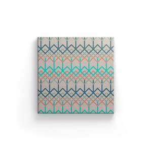 May include: Square canvas art featuring a geometric pattern of interlocking lines in teal, blue, coral, and gray. The design is set against a neutral beige background, creating a modern and abstract aesthetic. The artwork is displayed on a white background.
