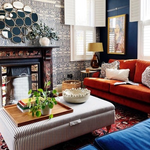 Lifestyle image-colourful living room with a walnut ottoman tray.