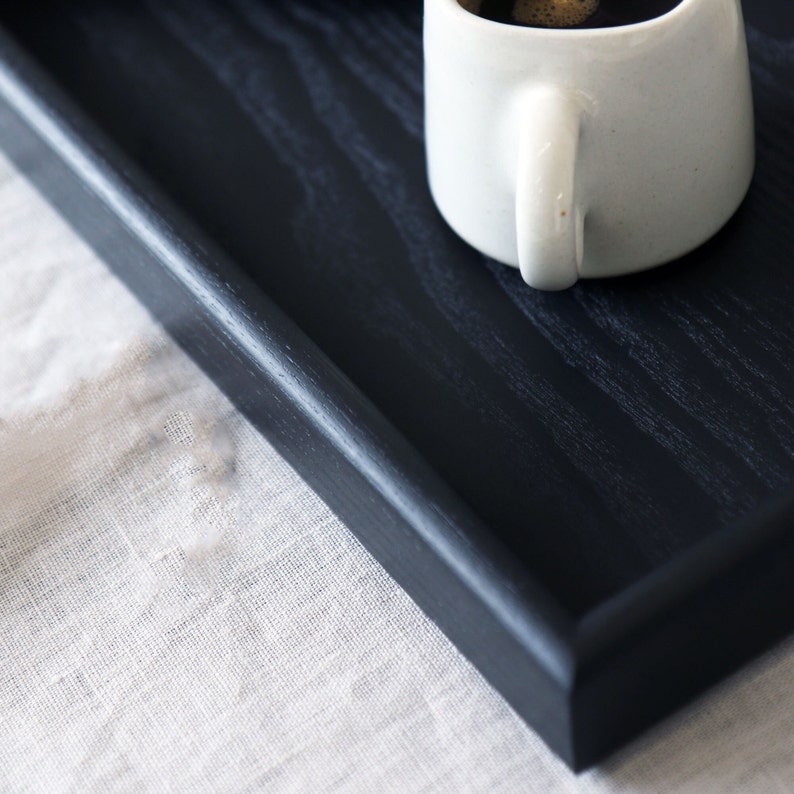 Close up image of the black ottoman tray