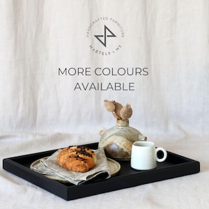 May include: Black wooden tray with a croissant, a small white ceramic cup, and a ceramic vase with dried flowers. The text "MORE COLOURS AVAILABLE" is printed on a white background.