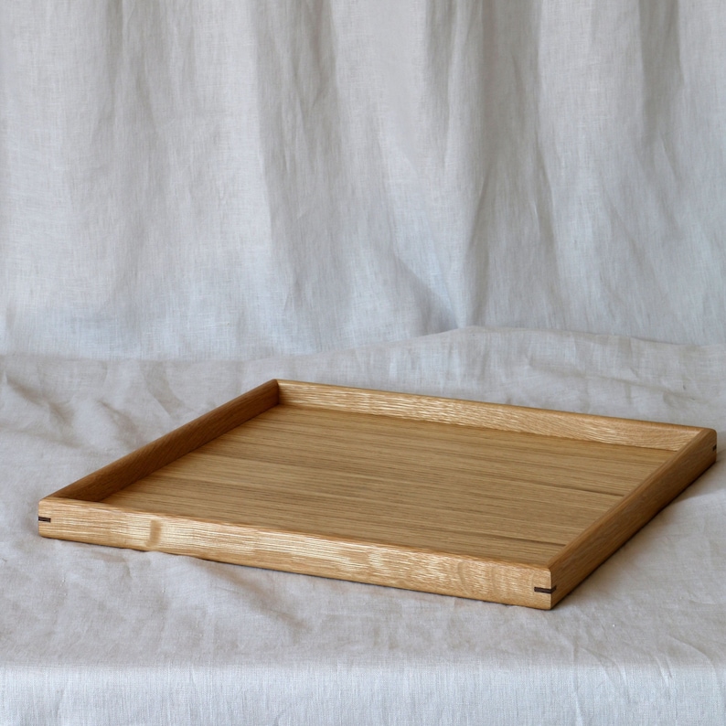 Oak serving tray with contrasting walnut corner pins