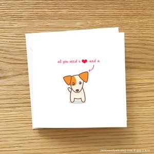 May include: A white card with a red heart and the text "all you need is &hearts; and a" with an arrow pointing to a cartoon image of a white and orange dog.