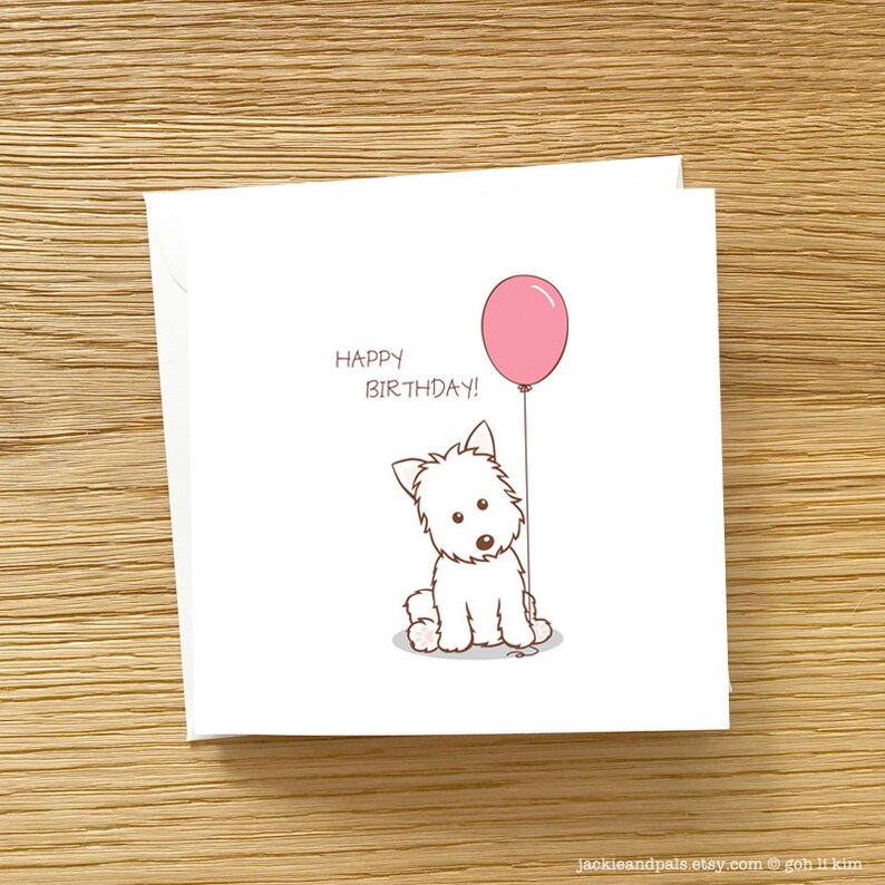 May include: A white card with a cartoon white dog holding a pink balloon. The card says "Happy Birthday!" in brown text.