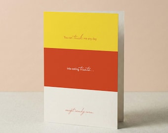 May include: A rectangular greeting card featuring three horizontal color blocks in yellow, orange, and white. The text reads: You can trick me any day, into eating treats..., except candy corn. The lettering is in a thin, red cursive font.
