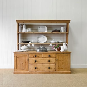 An Early 19th Century Monumental Pine Welsh Dresser or Cupboard