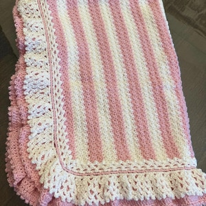 Pink and white ruffle blanket