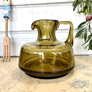Mid Century smokey green handblown glass pitcher, green glass juice jug, water pitcher. mid century glassware pitcher, green glass vase