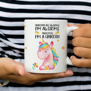May include: White ceramic mug with a pink unicorn illustration and the text "Unicorns are awesome I'm awesome therefore I'm a unicorn".