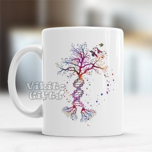 May include: White ceramic mug with a colorful watercolor design of a tree with roots that resemble a DNA strand. The tree has a purple, pink, blue, and green color scheme.