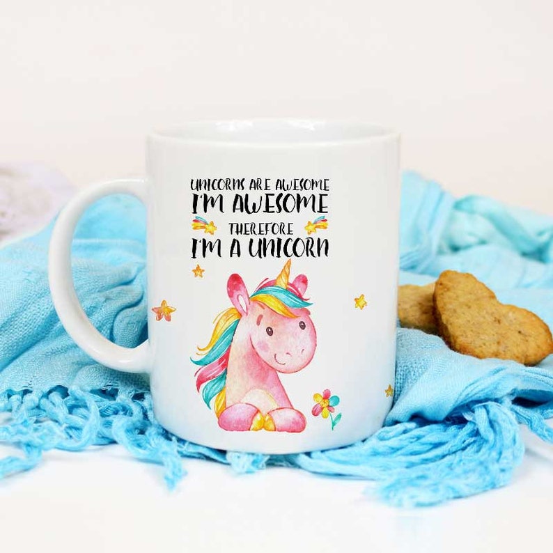 May include: White ceramic mug with a pink unicorn illustration and the text "Unicorns are awesome I'm awesome therefore I'm a unicorn".