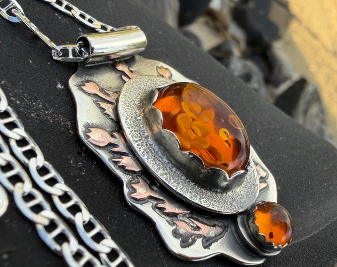 Featured listing image: Carved Amber Flower Pendant. Mixed Metal Copper and Argentium Sterling Silver Necklace.