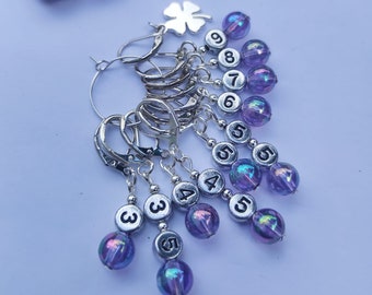 Good luck bubbles, purple glass hook, needle size reminders, knitting, crochet, flos crafty cro, stitch markers, progress keeper, notions,