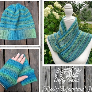 Op de afbeelding: Een haakset bestaande uit een muts, sjaal en vingerloze handschoenen in tinten blauw en groen. De set heet "Rocky Mountain Trail" en is gemaakt door "Floss's Crafty Crochet".