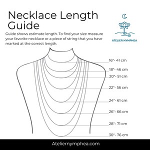 May include: A black and white necklace length guide featuring a diagram of a neck with multiple chain lengths ranging from 41 cm to 76 cm. The text reads Necklace Length Guide, Atelier Nymphea, and includes instructions for measuring.