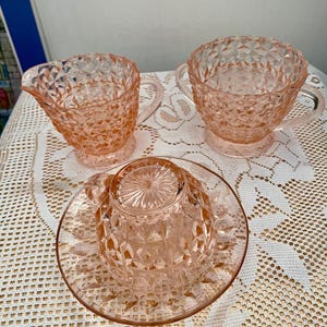 Jeannette Pink depression 1930’s glass creamer, sugar bowl, Holiday pattern, plus cup & saucer Windsor pattern