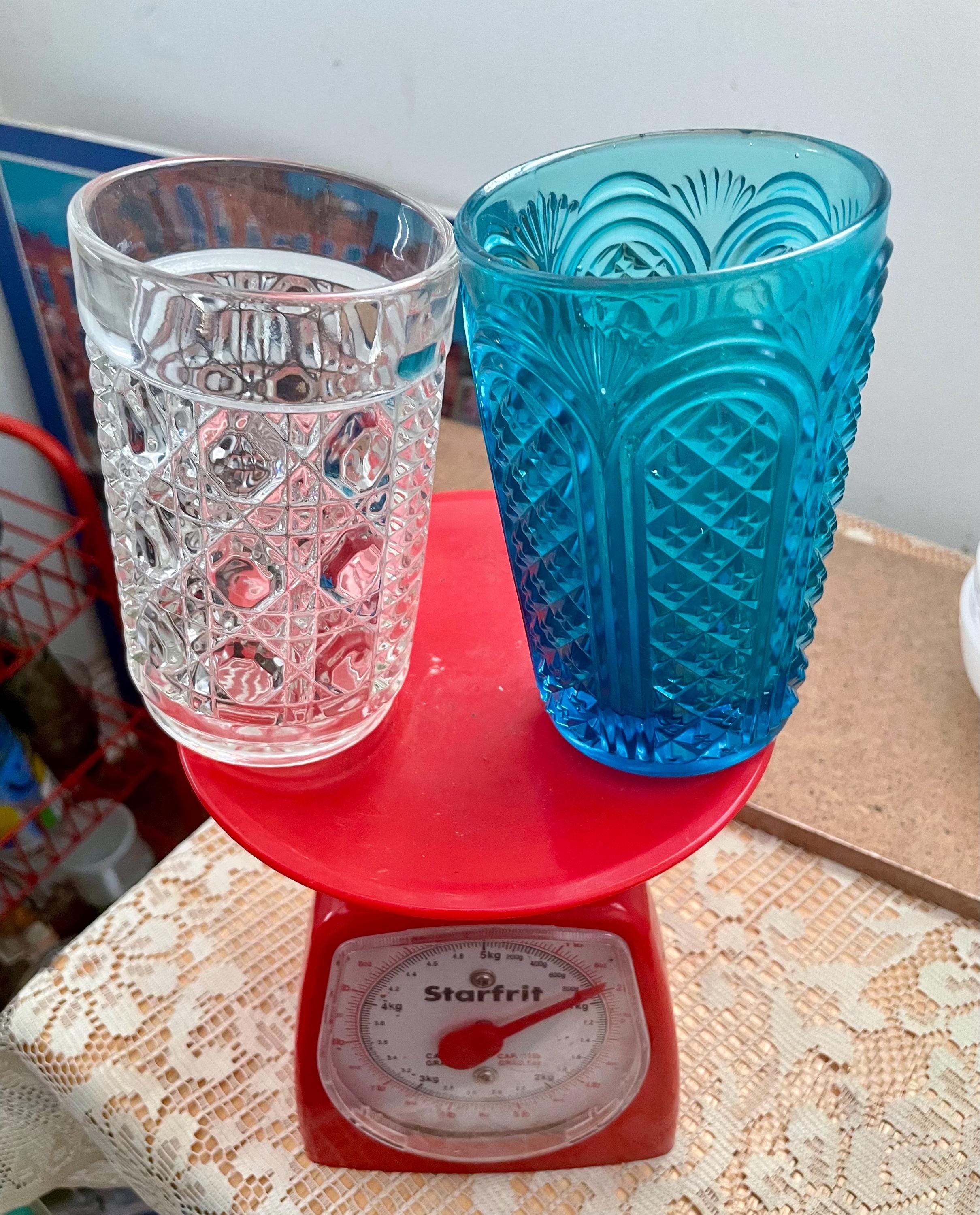 Pair of vintage embossed, textured goblets, the clear glass pattern is button and cane, the turquoise goblet is another vintage pattern.