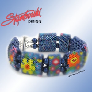 May include: A blue beaded bracelet with colorful floral patterns and a silver clasp. The bracelet is made by Stamborski Design.