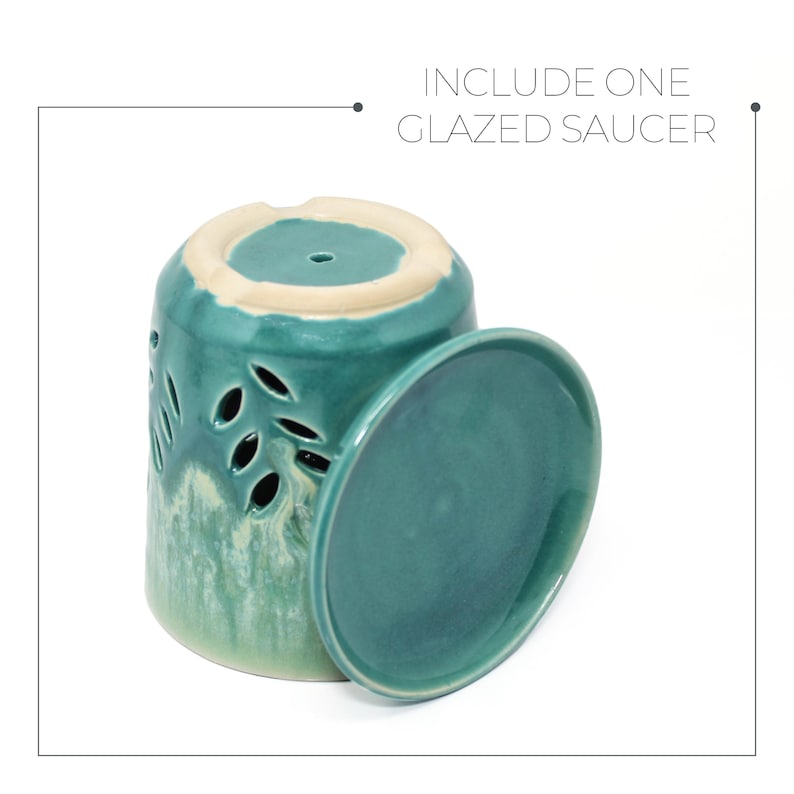 May include: A teal glazed ceramic planter with drainage holes and a matching saucer. The planter has a light green and white glaze with a mottled effect.  "INCLUDE ONE GLAZED SAUCER" is written in black text at the top of the image.