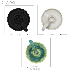 May include: Three ceramic candle holders with different glazes: black, white, and a green and blue turquoise glaze. The holders have a simple design with a small handle.